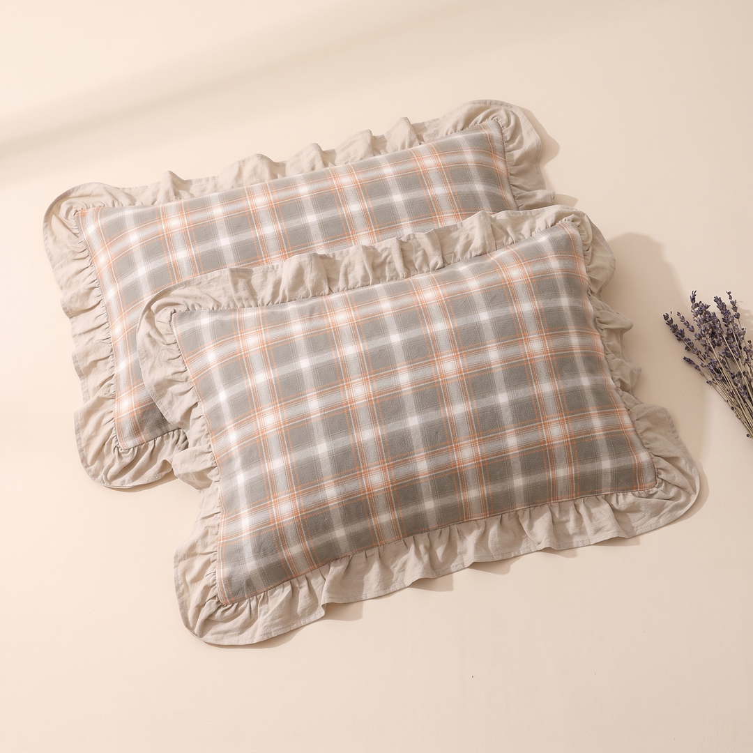 Cotton Pillowcases – Ruffled Plaid, Set of 2 in Beige Plaid – overlapping pair beside a sprig of dried lavender