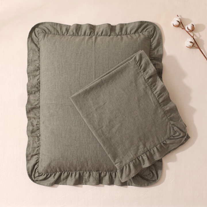 Cotton Pillowcases – Ruffled Plaid, Set of 2 in Khaki – one folded case atop another beside a cotton branch
