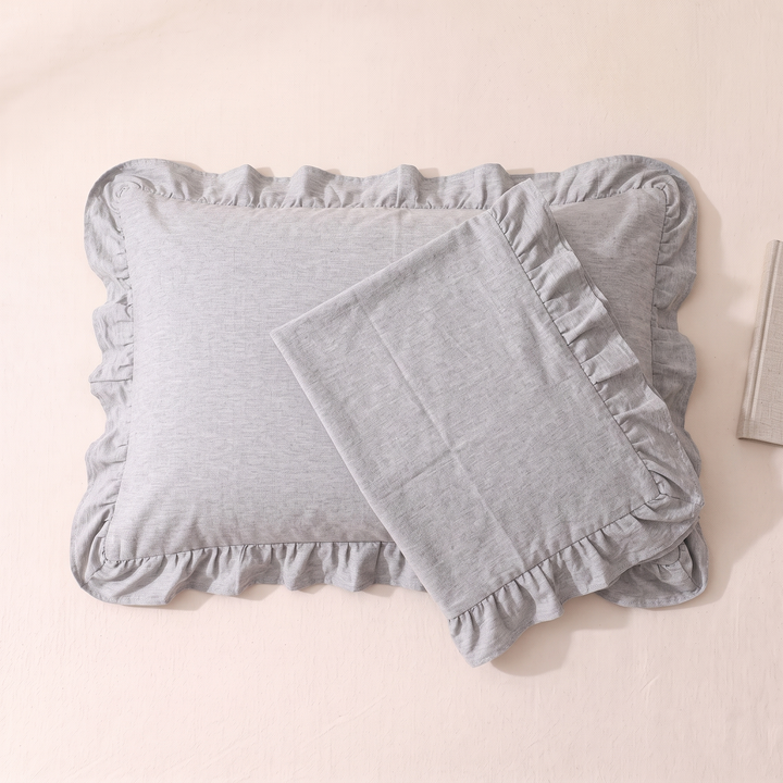 Cotton Pillowcases – Ruffled Plaid, Set of 2 in Light Gray – one case angled over a filled pillow on cream sheet