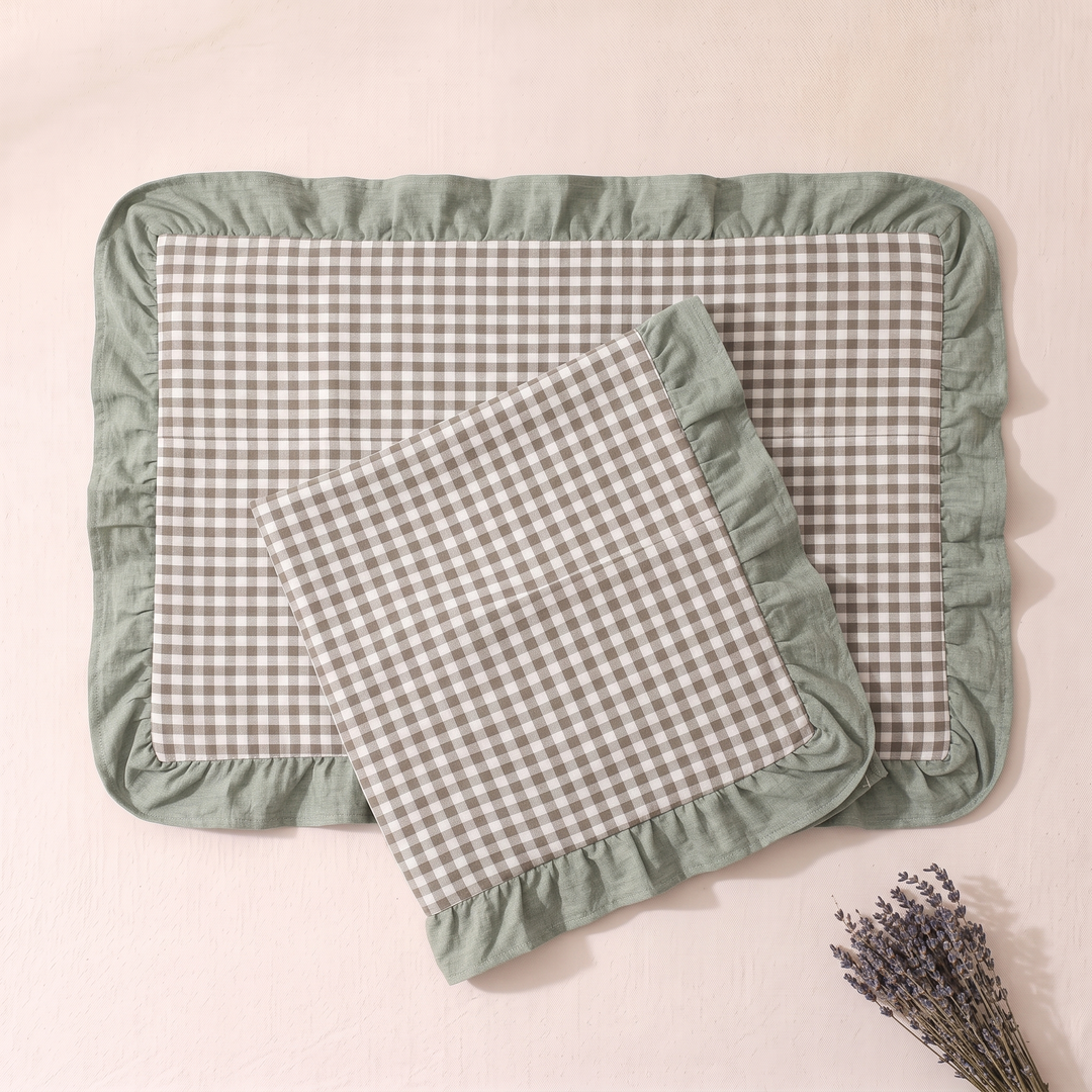Cotton Pillowcases – Ruffled Plaid, Set of 2 in Sage Gingham – one case tilted over another flat one, dried lavender in lower corner