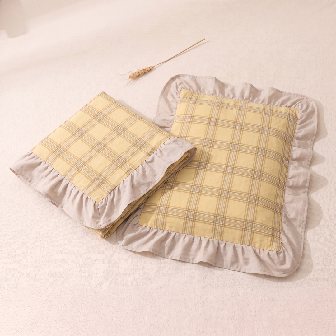 Cotton Pillowcases – Ruffled Plaid, Set of 2 in Yellow Plaid – folded case beside flat case with a wheat stalk above