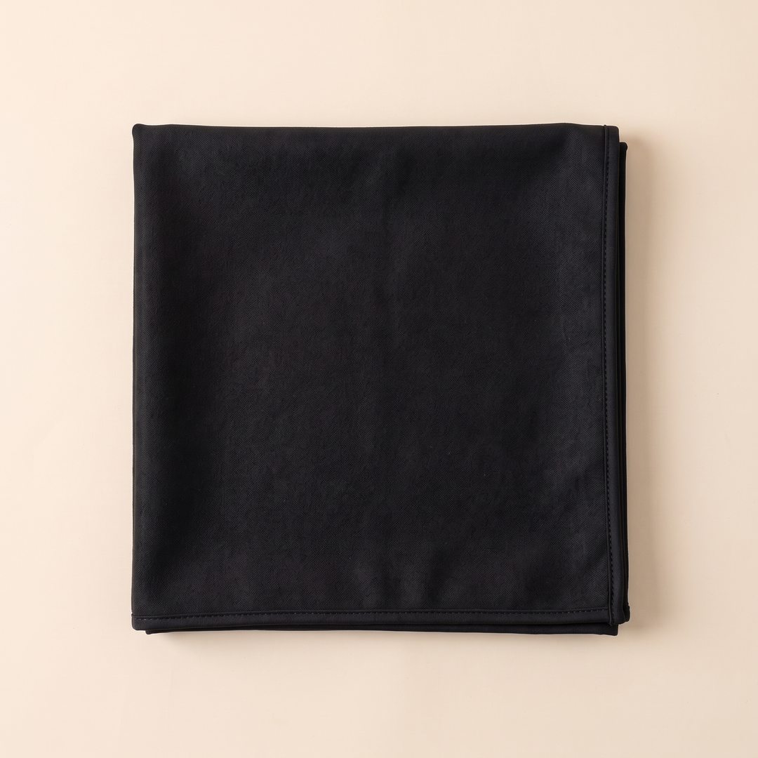 Sand-Free Beach Towel – Quick-Dry in Black – overhead view of towel folded into a flat square