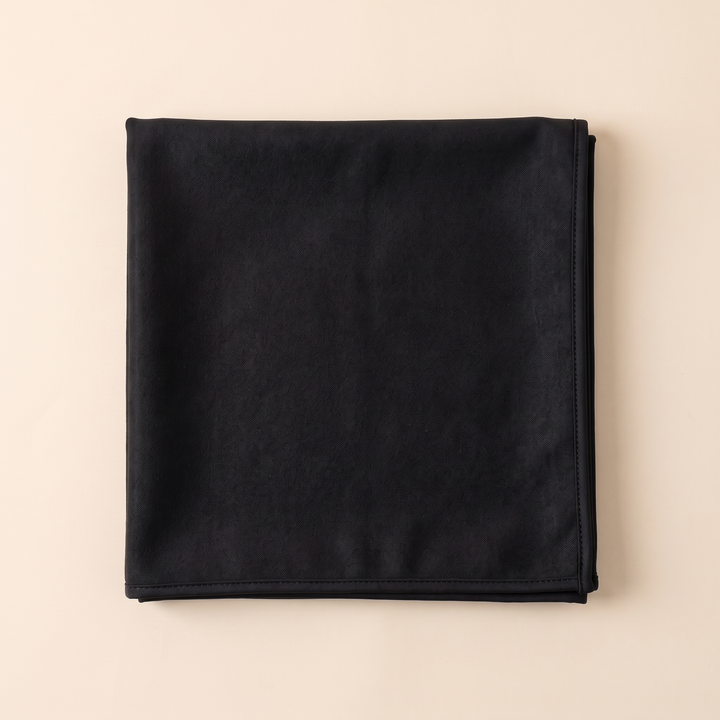 Sand-Free Beach Towel – Quick-Dry in Black – overhead view of towel folded into a flat square