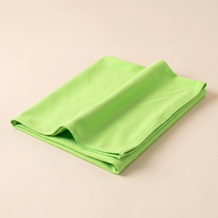 Sand-Free Beach Towel – Quick-Dry in Lime Green – loosely folded with a gentle wave in the top layer