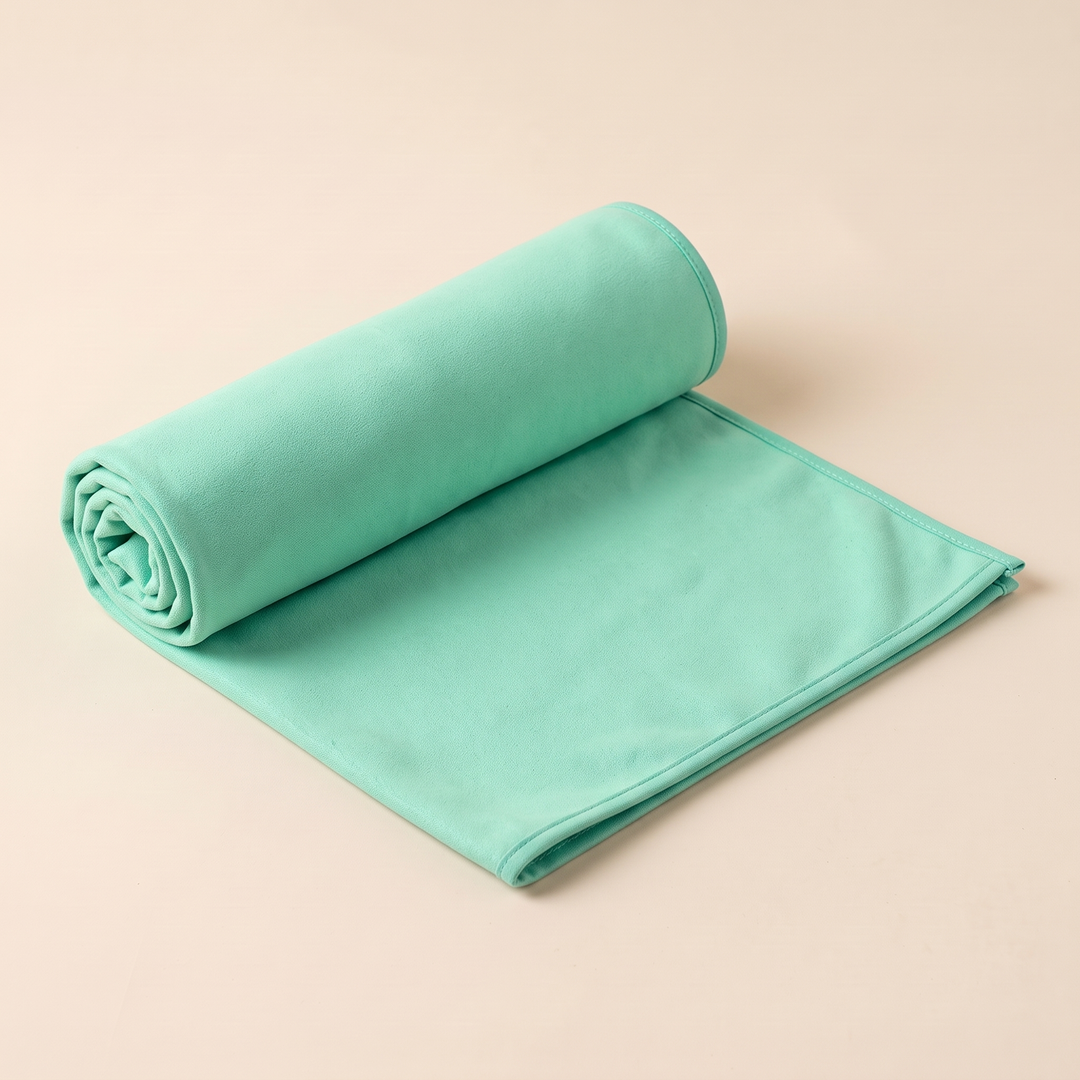 Sand-Free Beach Towel – Quick-Dry in Seafoam Green – one end rolled up while the rest lies flat