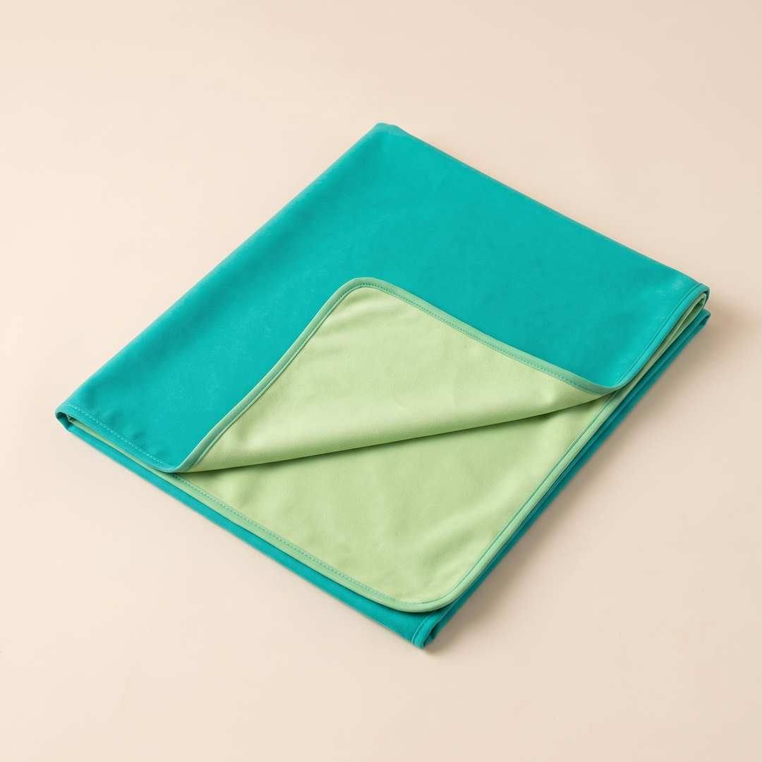 Sand-Free Beach Towel – Quick-Dry in Teal &amp; Light Green – triangular flap lifted to reveal contrasting lining on peach