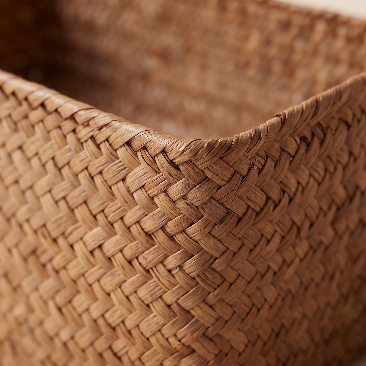 Seagrass Woven Basket – Bathroom Storage in Natural – close-up of the woven texture along the basket's rim and corner