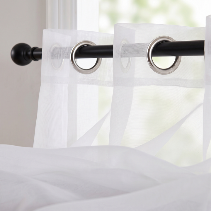 Sheer Voile Curtain Panel – Grommet Top in White – close-up of nickel grommets on a black rod