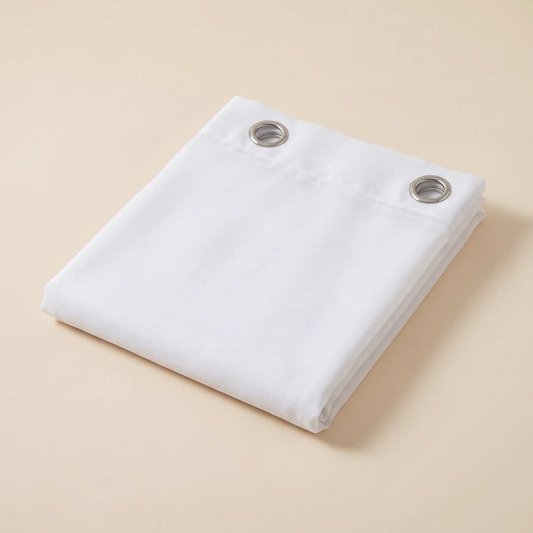 Sheer Voile Curtain Panel – Grommet Top in White – folded neatly on a plain beige background, two grommets visible