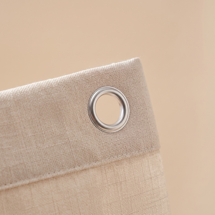 Close-up of the linen-look weave and metal grommet