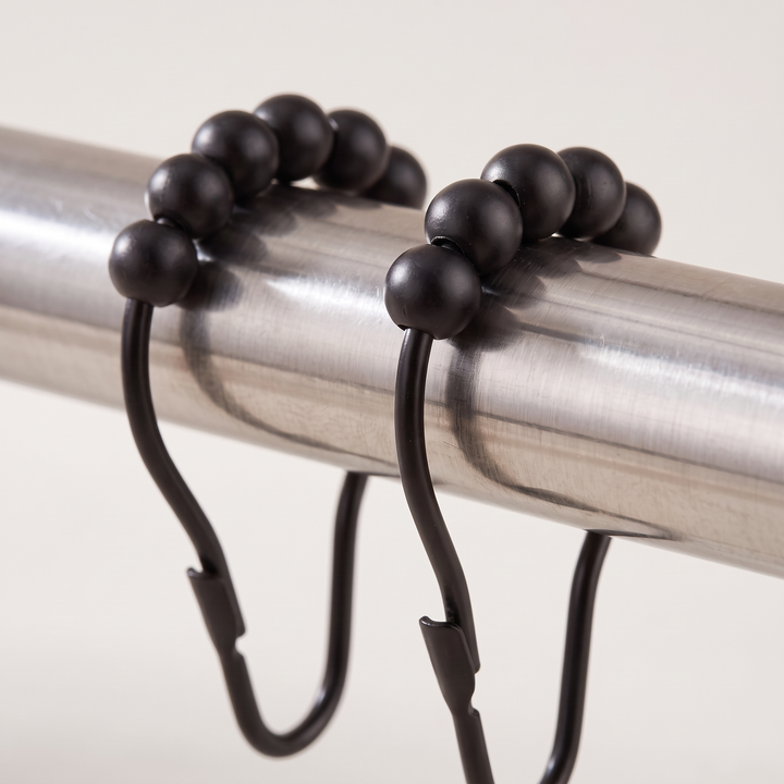 Shower Curtain Hooks – Set of 12, Roller Ball in Black – close-up of roller balls and snap clasps on a brushed steel rod