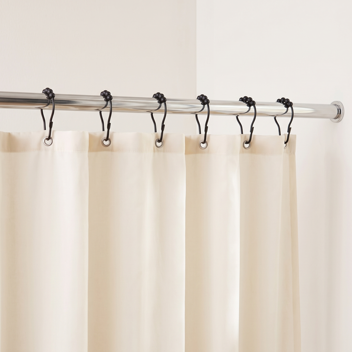 Shower Curtain Hooks – Set of 12, Roller Ball in Black – six hooks holding a cream curtain on a chrome rod