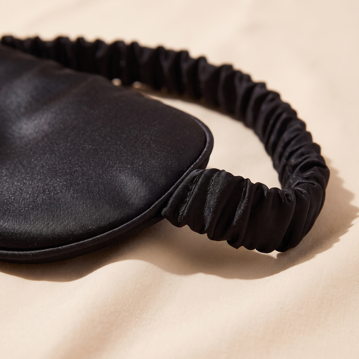 Silk Sleep Mask in Black – close-up of the gathered elastic strap and edge stitching