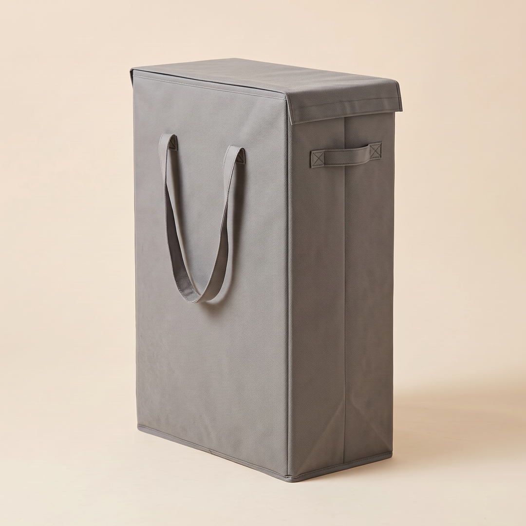 Slim Laundry Basket with Lid in Gray – narrow side with loop handle, lid closed