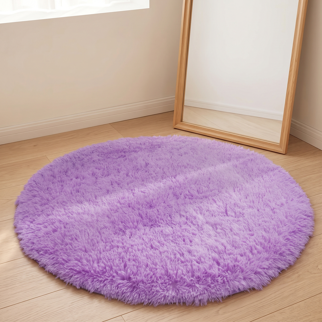 Small Round Shag Rug in Lavender – on a wood floor beside a leaning full-length mirror