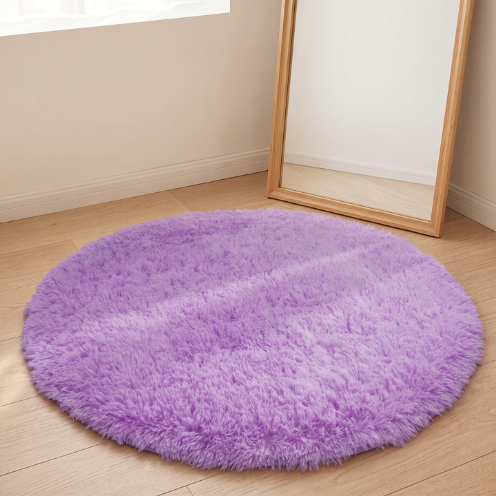 Small Round Shag Rug in Lavender – on a wood floor beside a leaning full-length mirror