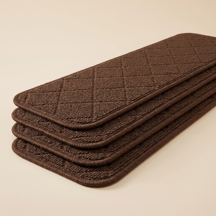 Carpet Stair Treads – Non-Slip, Self-Adhesive in Chocolate Brown – stacked in a neat pile at an angle on a plain cream background