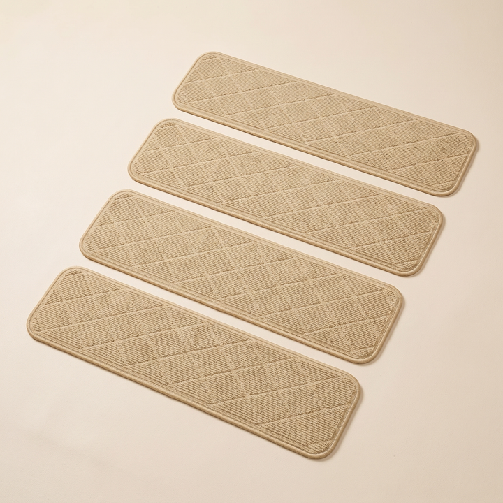 Carpet Stair Treads – Non-Slip, Self-Adhesive in Beige – set of four laid out in parallel rows on a plain background