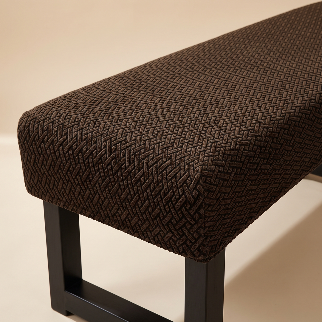 Stretch Bench Seat Cover – Jacquard in Chocolate Brown – cropped three-quarter view of the bench end and black legs