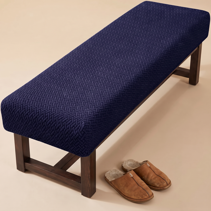 Stretch Bench Seat Cover – Jacquard in Navy Blue – with a pair of tan shearling slippers beside it