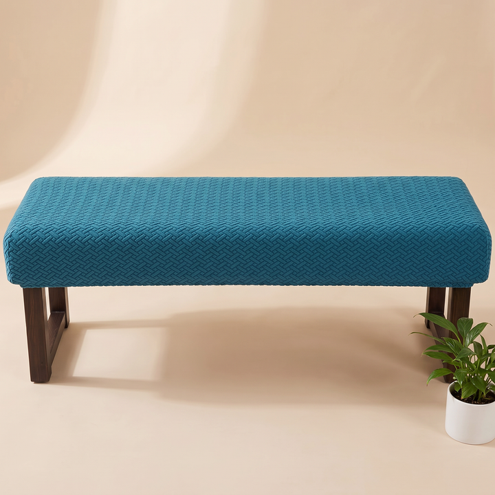 Stretch Bench Seat Cover – Jacquard in Teal – with a small potted plant beside the right leg