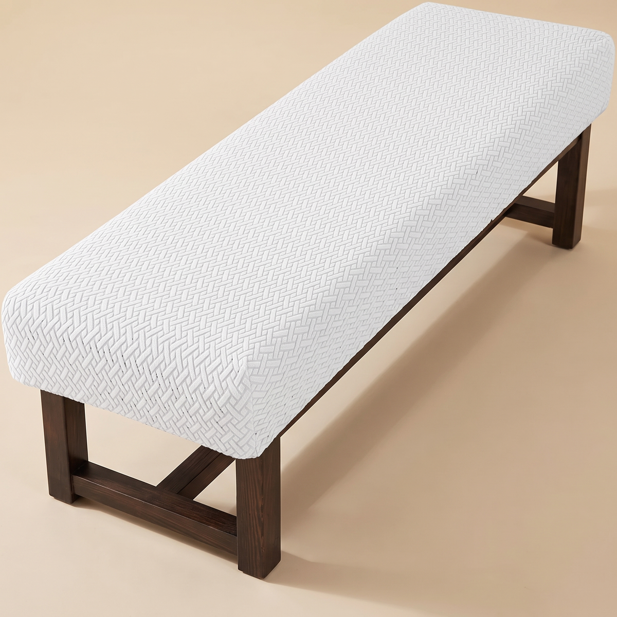 Stretch Bench Seat Cover – Jacquard in White – fitted on a dark wood bench, shown from above at an angle