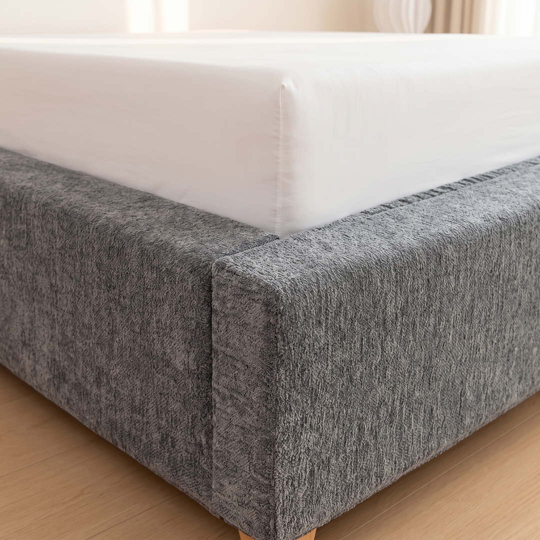 Stretch Box Spring Cover in Gray – fitted on a box spring beneath a white mattress