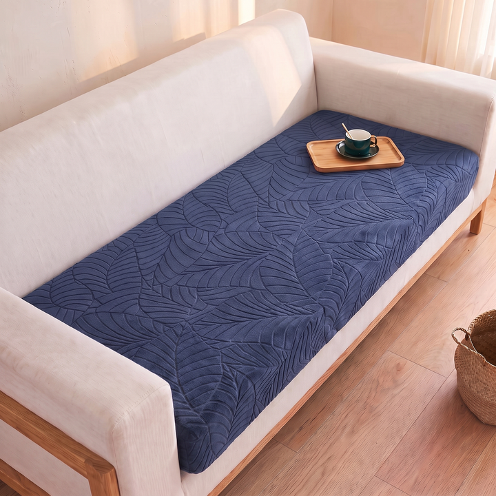 Stretch Couch Cushion Cover – Leaf Jacquard in Navy Blue – wooden tray with teacup on seat, wicker basket on floor