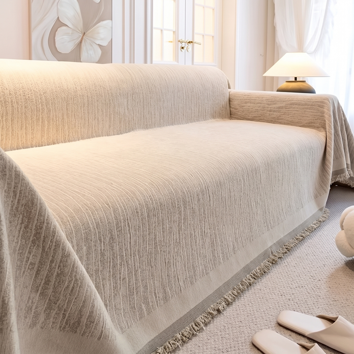 Striped Chenille Couch Cover with Fringe in Beige – covering a sofa near butterfly wall art and slippers