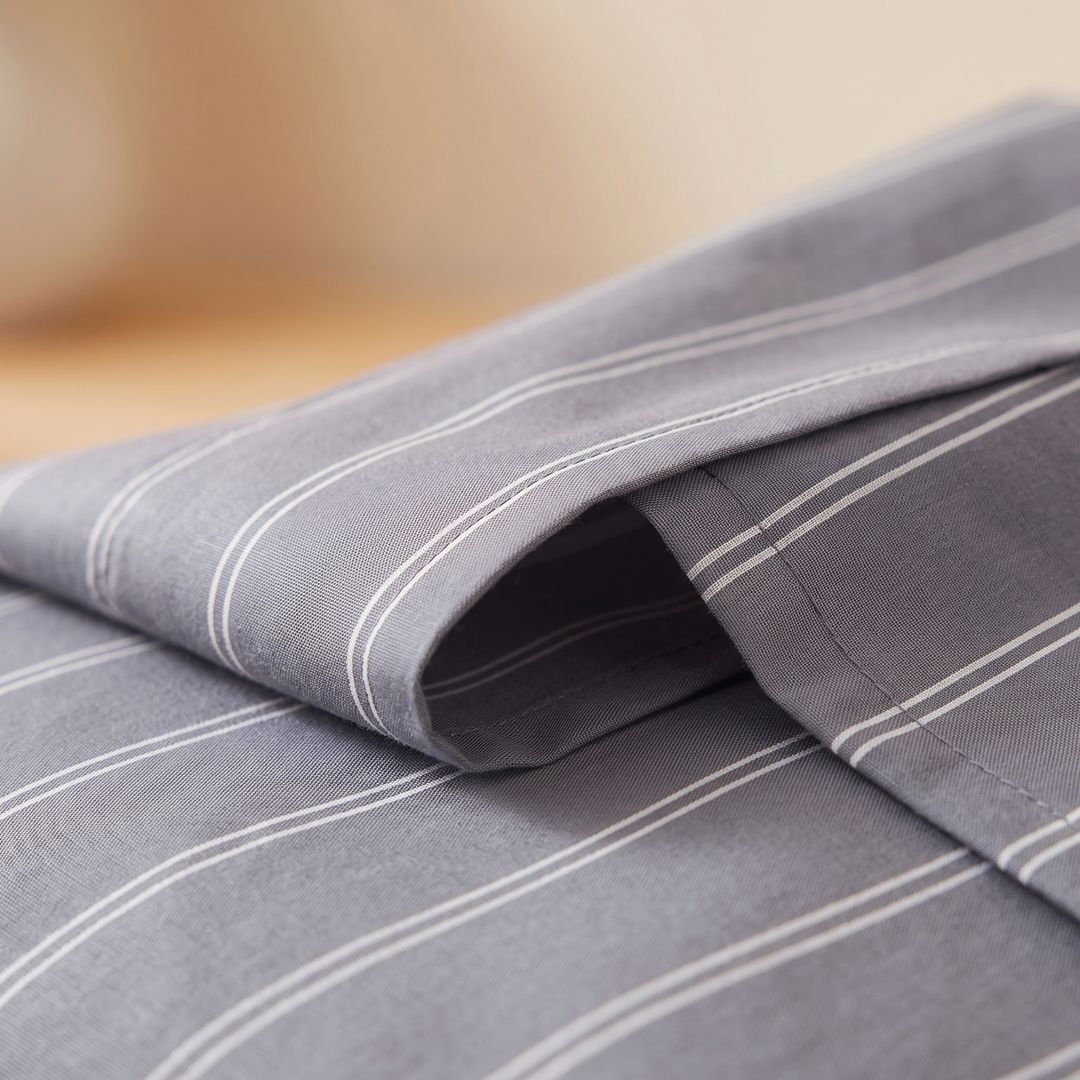 Striped Cotton Pillowcases – Set of 2 in Charcoal Stripe – close-up of the open hem edge and stitching