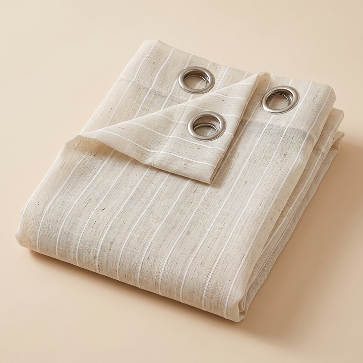Striped Sheer Curtain Panel – Linen Look in Oat – folded neatly with a corner turned back showing grommets