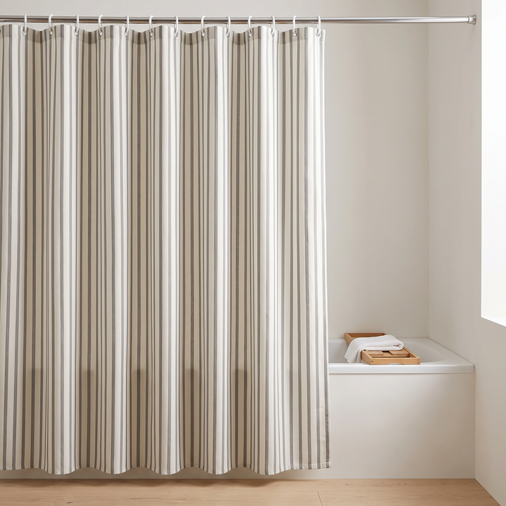 Striped Shower Curtain with Hooks in Gray Stripe – full-length drop closed beside a tub with wooden tray