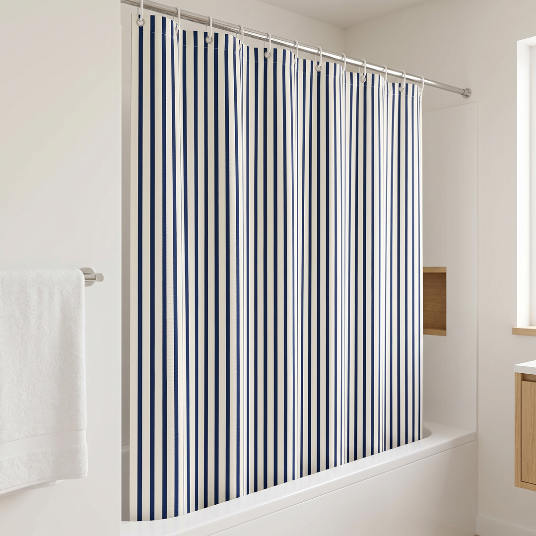 Striped Shower Curtain with Hooks in White &amp; Navy Stripe – angled side view beside a towel bar and wooden wall niche