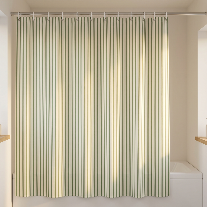 Striped Shower Curtain with Hooks in Sage Green Stripe – hung on a rod above a bathtub in a bright bathroom