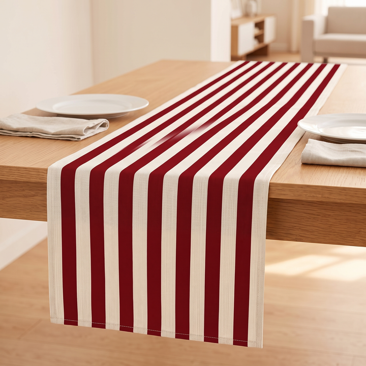 Striped Table Runner in Red Stripe – running between two place settings with plates and folded napkins