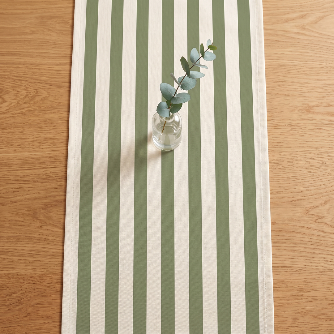 Striped Table Runner in Sage Green Stripe – overhead view with eucalyptus sprig in glass vase