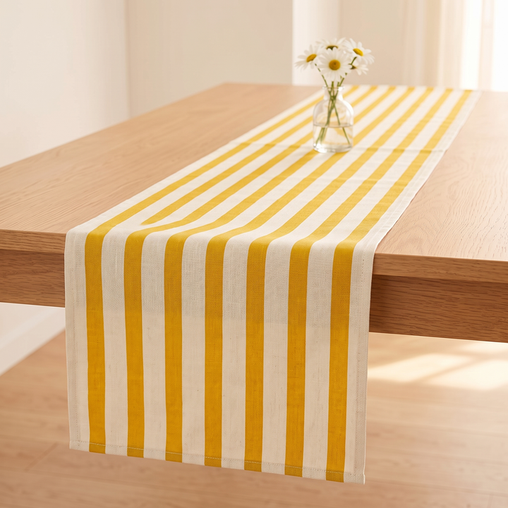 Striped Table Runner in Yellow Stripe – long view down the runner to daisies in a glass vase