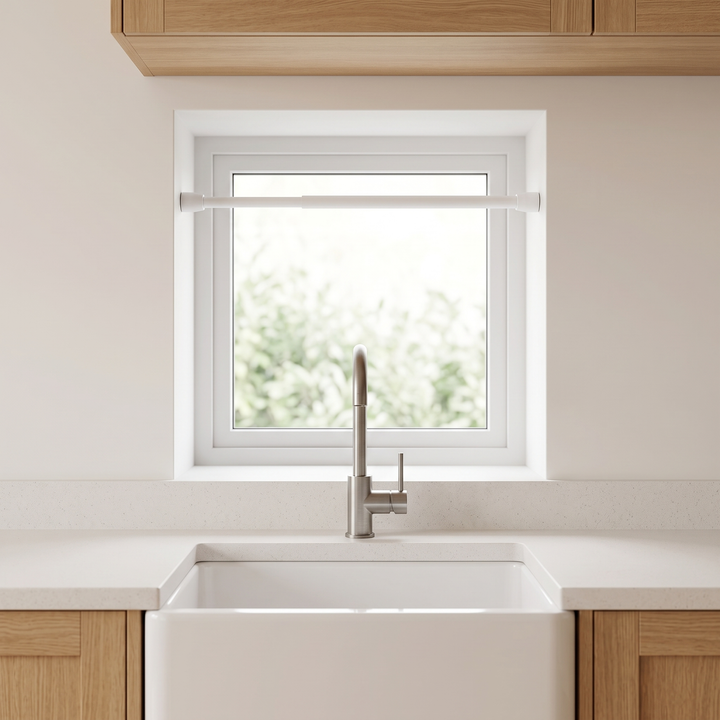 Tension Curtain Rod – No Drill in White – mounted across a small kitchen window above a farmhouse sink