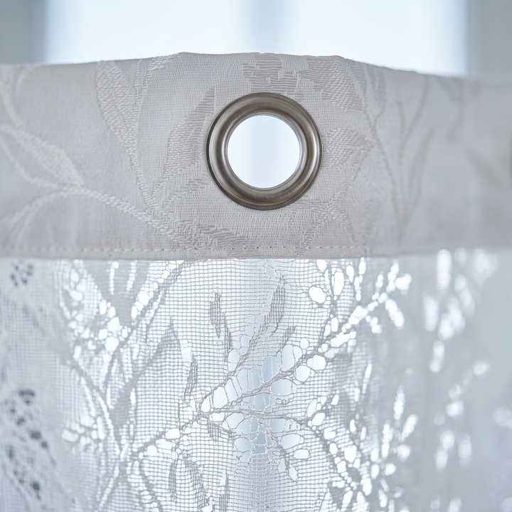 Textured Shower Curtain – Botanical Jacquard in White – close-up of the metal grommet and leaf patterned top hem