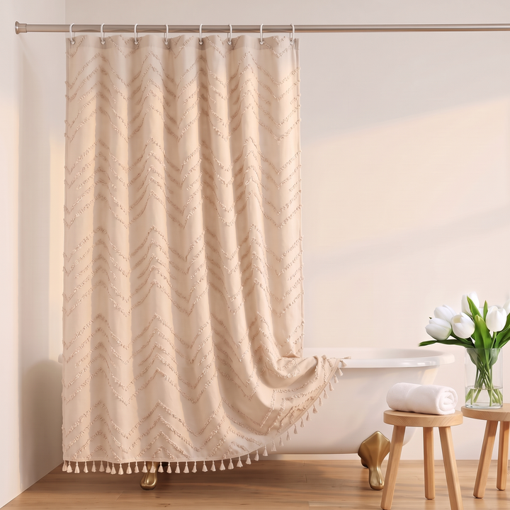 Boho Fabric Shower Curtain – Tufted, with Tassels in Beige Chevron – hem draped over clawfoot tub rim beside wooden stools