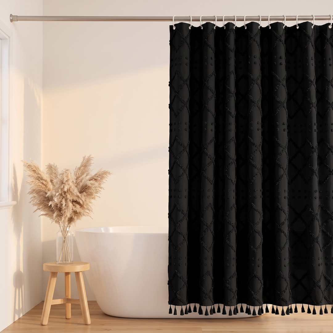 Boho Fabric Shower Curtain – Tufted, with Tassels in Black Diamond – in sunlit bathroom beside stool with dried pampas grass