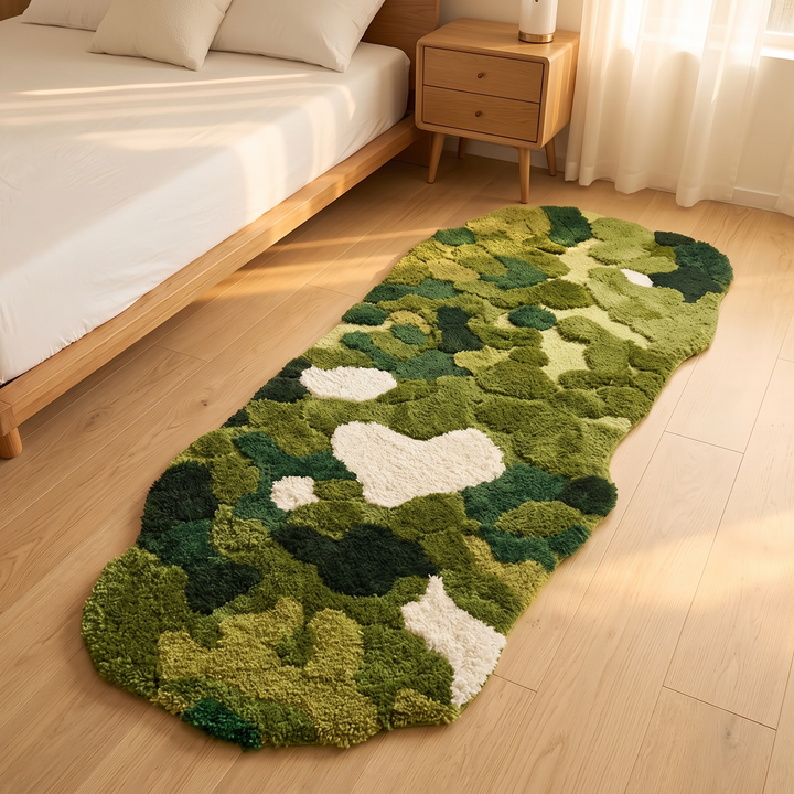 Green Moss Rug – Tufted in Moss Green – on a wood floor beside a bed in a sunlit bedroom