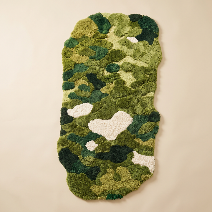 Green Moss Rug – Tufted in Moss Green – flat overhead view of the full irregular shape on a plain beige background