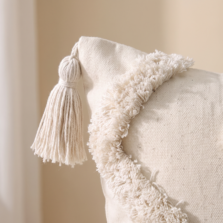 Boho Tufted Pillow Cover with Tassels in Cream – Zigzag – close-up of a corner tassel and curved tufted fringe