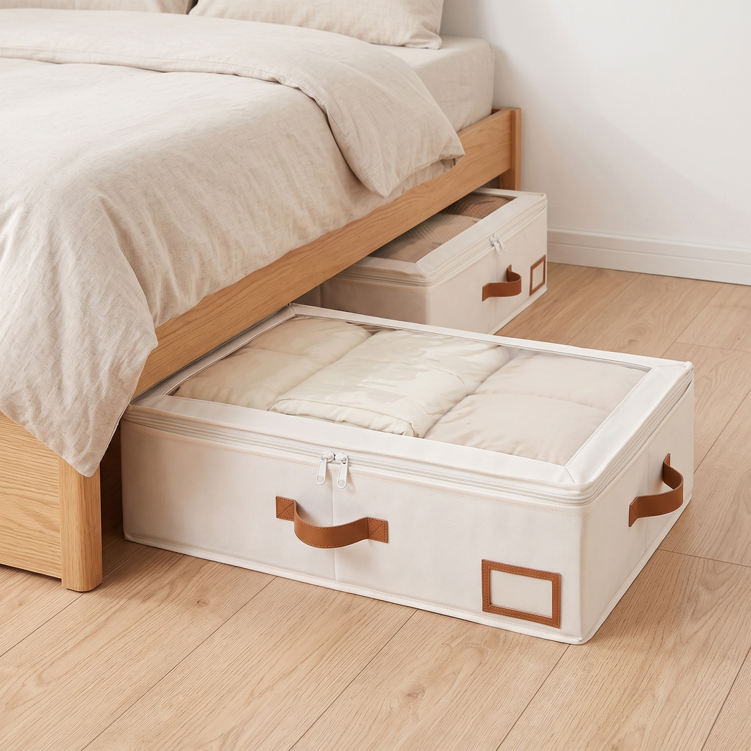 Under Bed Storage Bins – Set of 2 in Cream – two bins pulled out from under a wooden bed on a wood floor