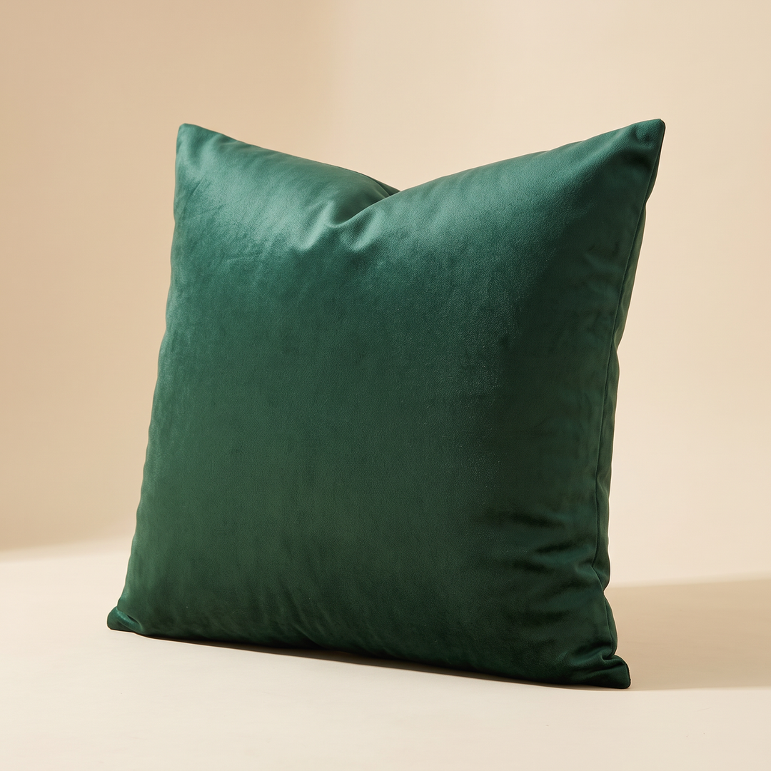 Velvet Pillow Cover in Dark Green – casting a soft shadow across a cream studio floor