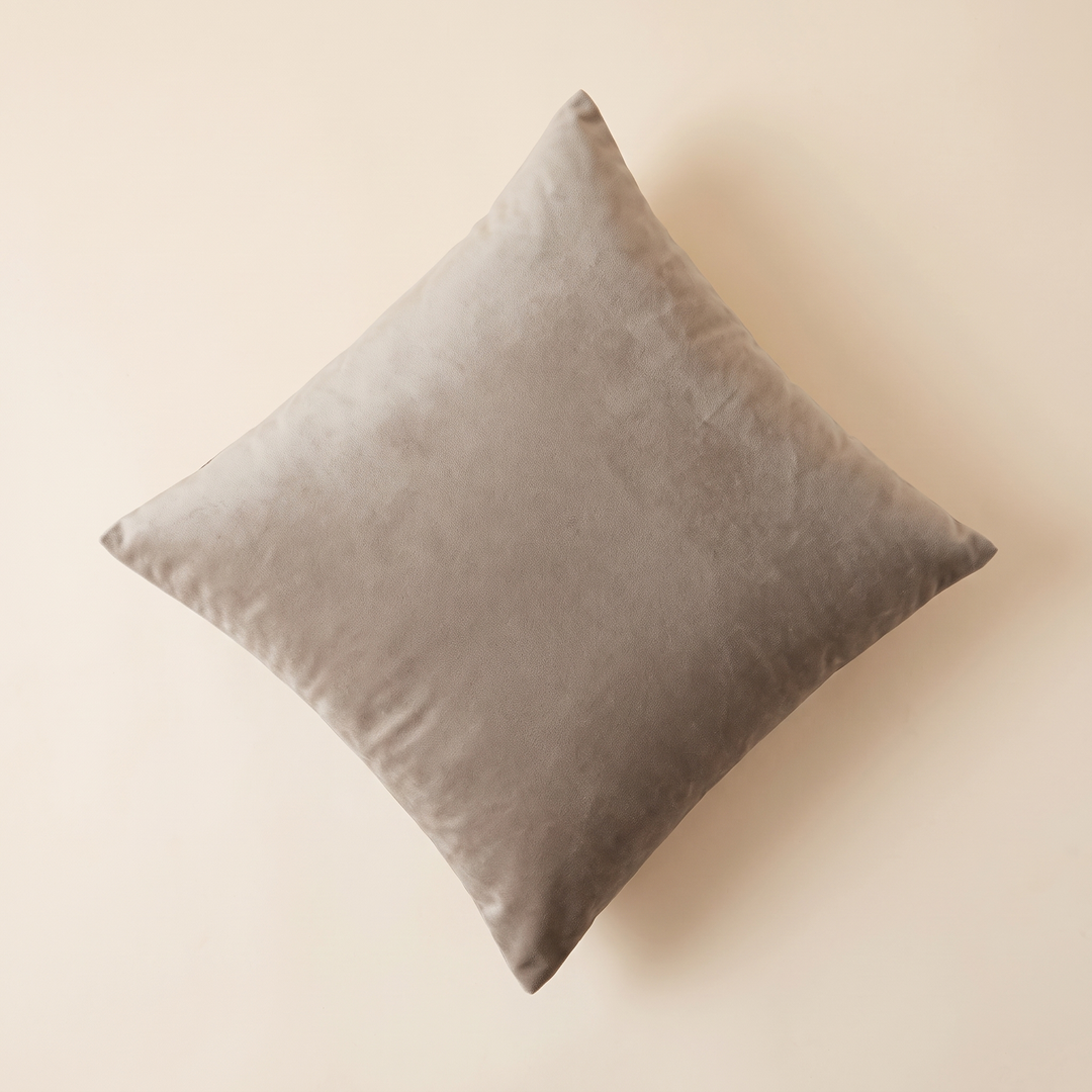 Velvet Pillow Cover in Taupe – flat lay from above, set diagonally on a plain cream surface