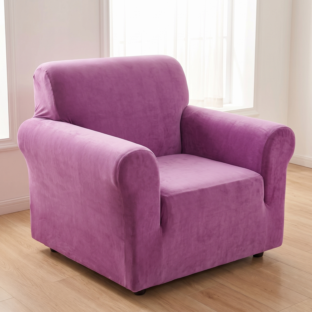 Velvet Stretch Sofa Cover in Magenta – fitted on a single armchair on light wood floor