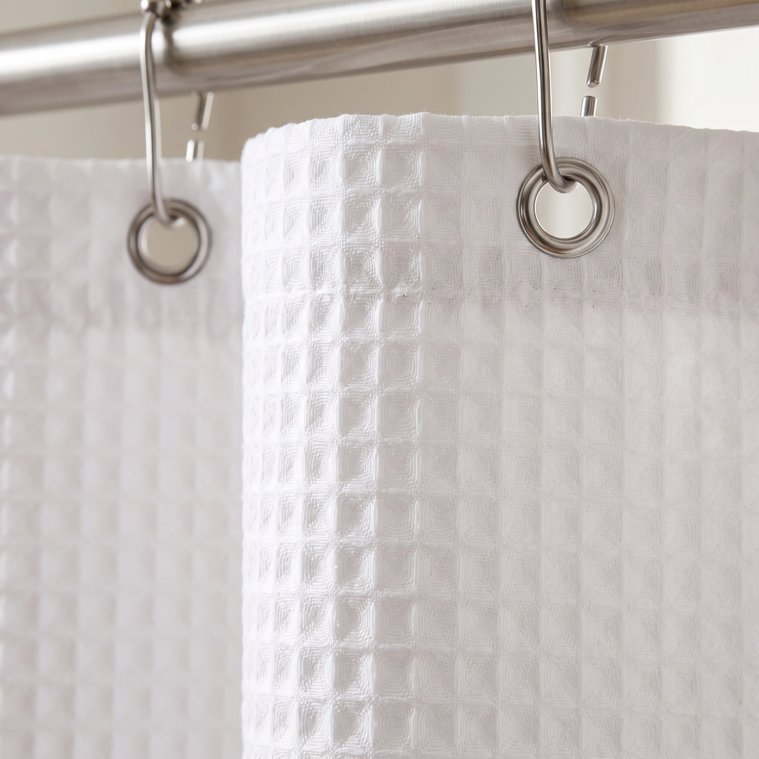Fabric Shower Curtain – Waffle Weave in White – close-up of the waffle texture and metal hooks on a rod