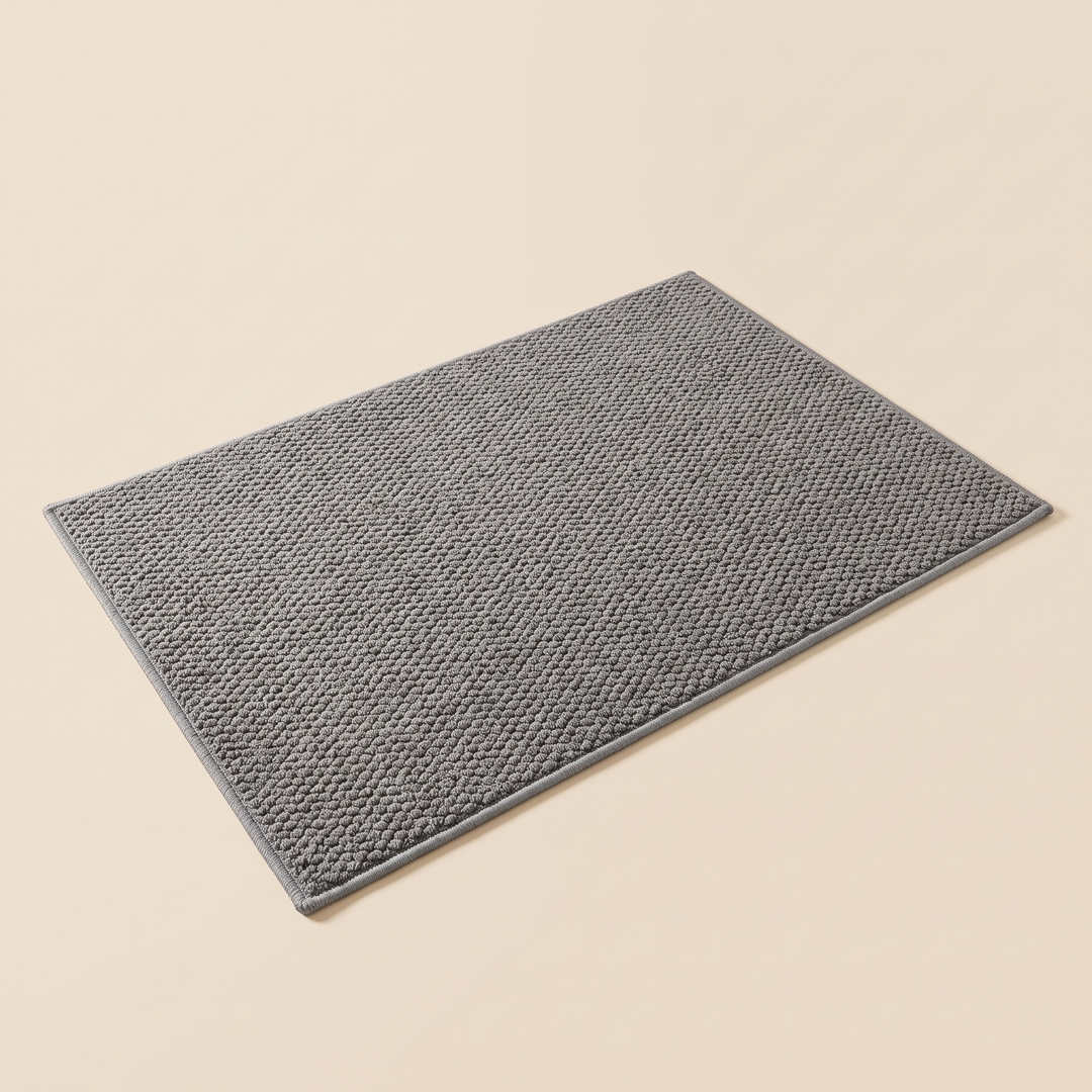 Indoor Door Mat – Washable, Non-Slip in Gray – laid flat at an angle on a plain beige background